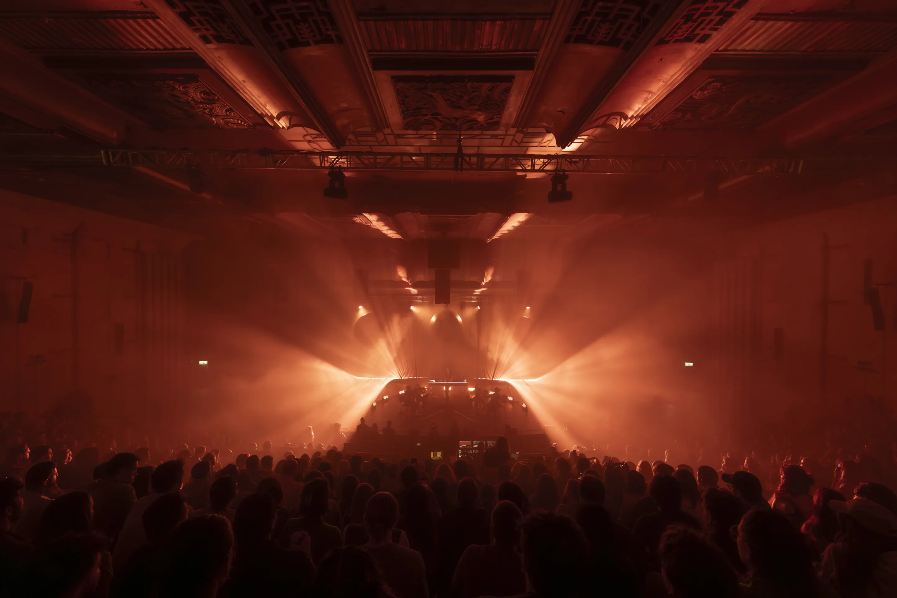 electronic music, Musicians photography featuring immersive visuals, pulsating energy, and audience interaction at a concert.